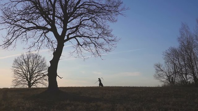 Grim Reaper sunset silhouette. concept of death