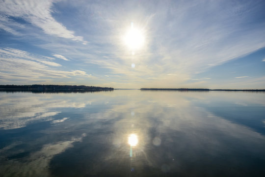 Still waters of Breton Bay create a mirror image of the late afternoon sky. © Tim
