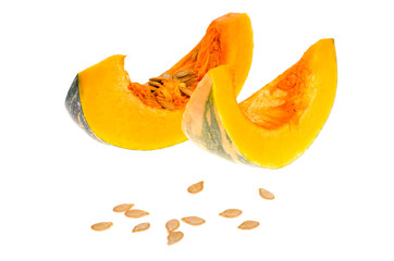 Orange pumpkin slices, seeds, isolated on white