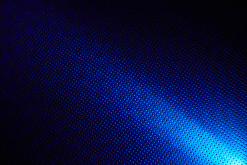 Diagonal bright beam of light on a blue background to the point