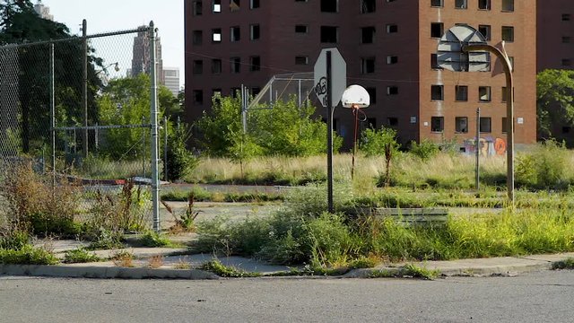 Deserted Basketball Court In Rough Neighborhood