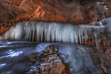 Frozen waterfall in a mountain gorge