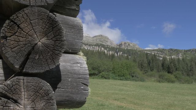 Slider shot of wooden barn revealing mountains towards Piz Boe near Corvara, Alta Badia, Province of Belluno, Italian Dolomites, Italy, Europe