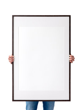 Holding frame mockup. Photo Mockup. The man hold frame. For frames and posters design. Frame size 24x36 (61x91cm).
