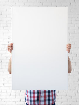 Holding Canvas Mockup. Photo Mockup. The Man Hold Canvas. For Canvas Design. Frame Size 24x36 (61x91cm).