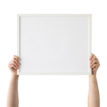 Holding frame mockup. Photo Mockup. Man hands hold frame. For frames and posters design. Frame size 20x16 (50x40cm).