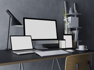 3d illustration of mockup design of clean white monitor screen for web preview on modern workplace indoor with desktop, tab, laptop, and phone on stylish black desk and grey wall in three quarter view