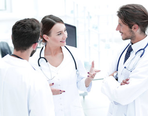 Fototapeta premium Team of different doctors having conversation