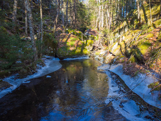 Obraz premium winter waterfall in the forest, winter, no people