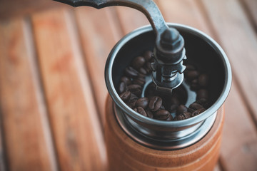 Closeup image of a vintage wooden coffee grinder