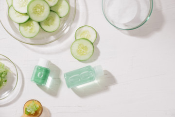 Cosmetic bottle and fresh organic cucumber for skincare. Home spa concept.