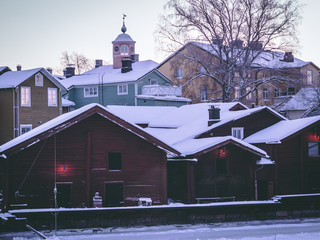 Old warehouses and pastel colored old town of Porvoo Finland in winter