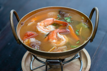Tom yam kung or Tom yum, Tom yam is a spicy clear soup typical in Thailand. Popular food in Thailand