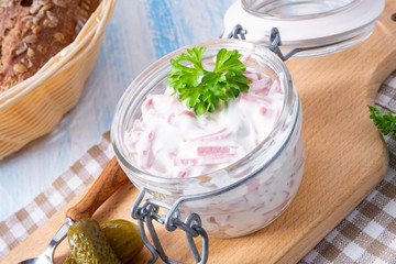 delicious homemade meat salad with mayonnaise and cucumber