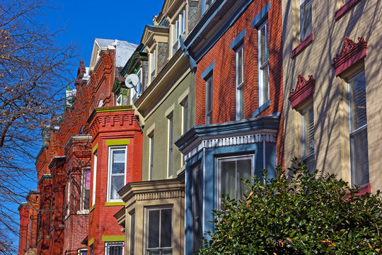 Historic residential townhouses in Washington DC suburb on a bright winter day. Row houses in close proximity to the city downtown.
