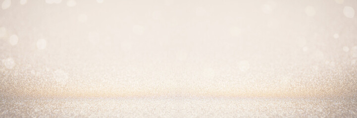 Abstract blur gold glitter christmas event celebration card design wide screen background concept - shiny golden light dust sparkle festive decoration effect, smooth holiday texture golden wallpaper, 