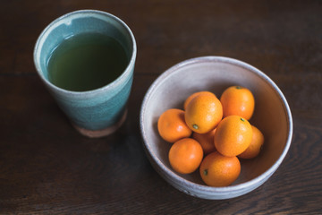 Hot green tea with kumquat orange