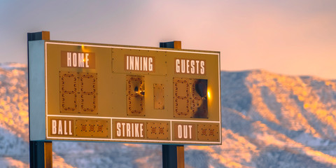 A baseball scoreboard against mountain in Utah