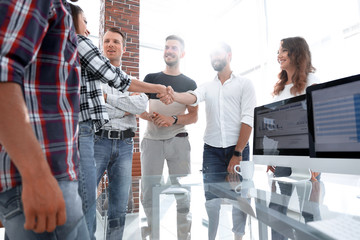 friendly handshake between Manager and employee