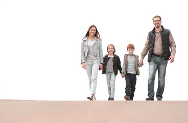 Fototapeta premium Happy family holding hands and walking