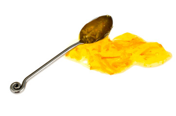 Spoon with sweet yellow jam on white background