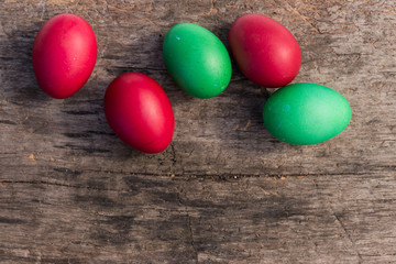 Fototapeta na wymiar Painted Easter eggs on rustic wooden background