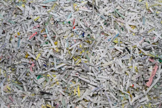 Closeup of multicolored shredded paper laid out on flat surface