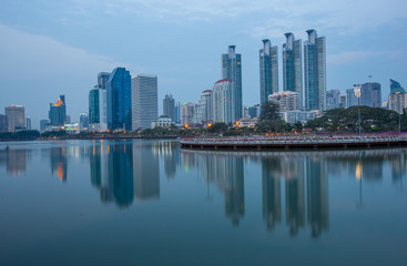 Fototapeta premium Background of flowers by the pool, wallpaper, high-rise buildings (condominiums, offices) that are located by the pool, parks, fitness areas of nearby residents.