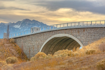 Bridge overlooking mountain and cloudy sky in Utah