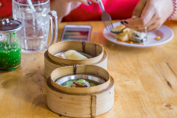 The background of food that is put in a wooden container (dim sum) containing vegetables, pork, flour Used to make, a menu that requires steaming stoves for good taste, delicious to eat 