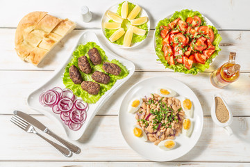 Oriental piyaz bean salad with meatballs. 