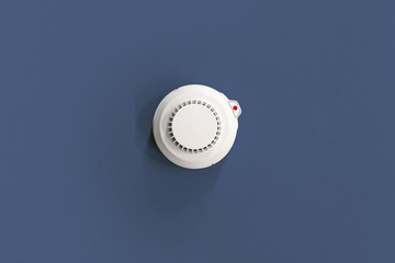 Smoke fire detected Smoke detector on dark blue. ceiling