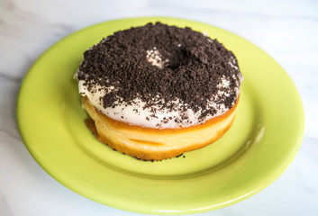Home made donut on a green plate