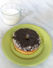 Home made donut on a green plate