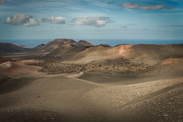 Fototapeta na wymiar Beautful day in Timanfaya National Park. Lanzarote Island, Canarias, Spain