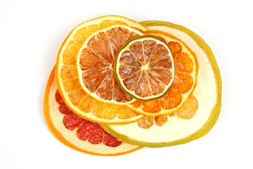 mix of different pieces of dried citrus fruit on white background