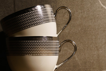 Coffee cup overlays on another one