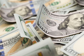 Close up heap of one hundred dollars, selective focus. Dollars, the us money background.