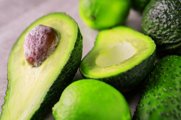 Fresh avocado with lime on napkin.