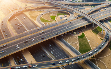 Aerial view sun Dubai skyline Road traffic