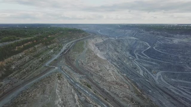 Open quarry for stone extraction. Quarry. Panorama aerial view. The problem of environmental pollution. Top view of the quarry
