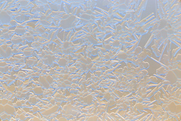 Snow patterns on glass as an abstract background