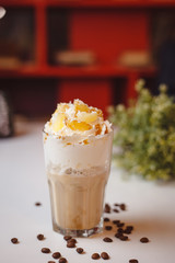 Cappuccino with cream and tangerine slices
