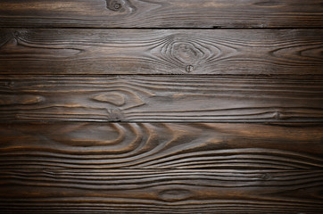 Natural dark wooden textured background of flat layed planks with weathered vintage oiled surface