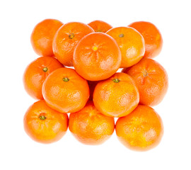 Bunch of ripe orange clementines isolated on white background