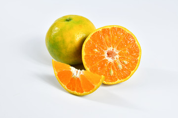 Half of orange and the whole orange. On white background.
