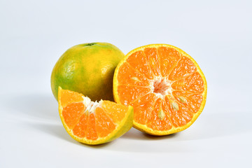 Half of orange and the whole orange. On white background.
