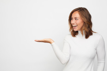 young happy woman presenting your product