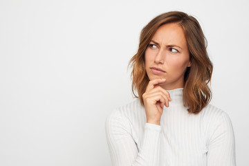 portrait of young woman thinking and wonder - 246565986