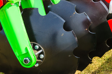 Detailed closeup of disc harrow agricultural machinery